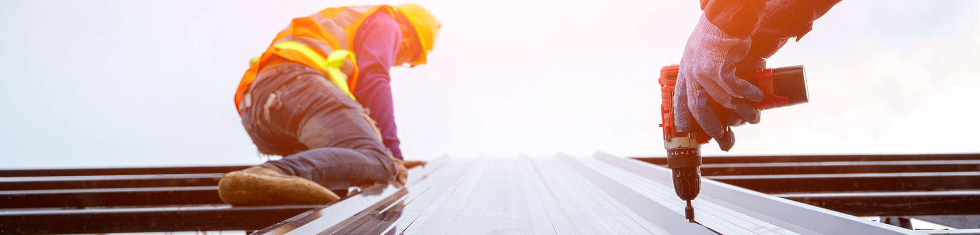Metal roof installation on commercial building