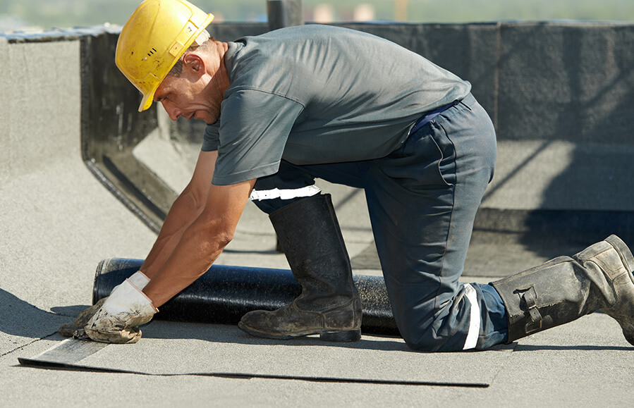 Commercial contractor fixing roof damage