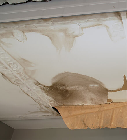 water stains showing signs of commercial roof leak